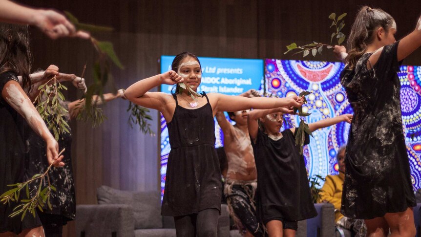 Young girls dance at the opening of the NAIDOC Women's Conference