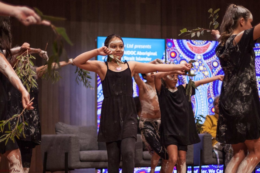Young girls dance at the opening of the NAIDOC Women's Conference