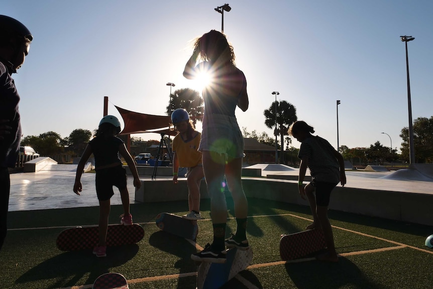 Skaters learning tricks