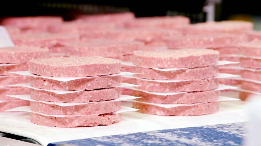 Neat piles of pink patties made by Impossible Foods and sold at Burger King in the United States