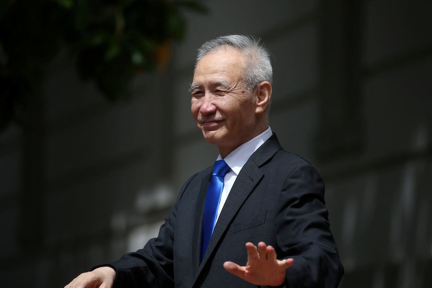 Chinese man in business suit smiling