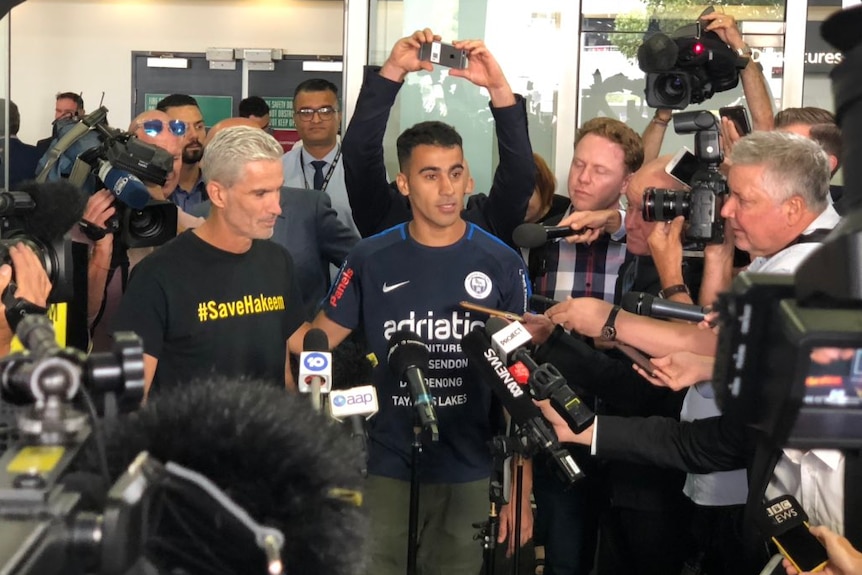 Hakeem al-Araibi speaking to a media scrum at Melbourne Airport.