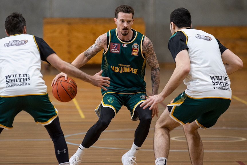 Basketball player Josh Adams in action.