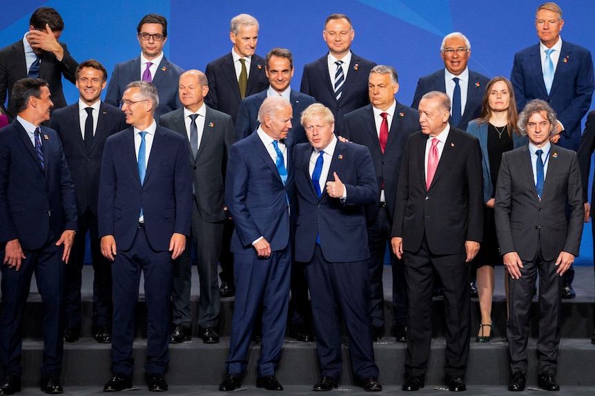 NATO leaders pose for a group photo in Madrid.