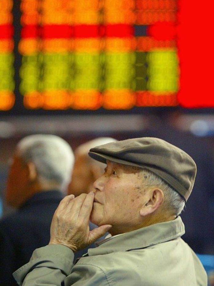 Worried investor at Shanghai Stock Exchange