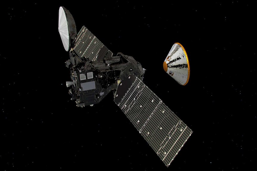 A large satellite with rectangular wings is in space, with a small dome spacecraft detaching from it