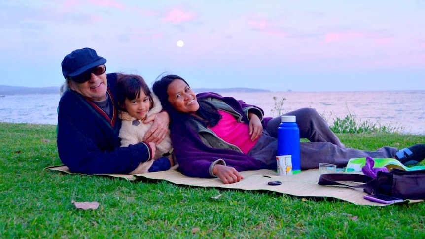 John Smith with his family on a picnic.