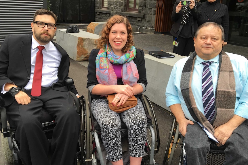 (L-R) Matt Lennonx and Alex Holland from Youth Disability Services, and Emilio Savle from Disabled Motorists Australia
