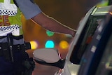A generic image of a police officer administering a roadside test.