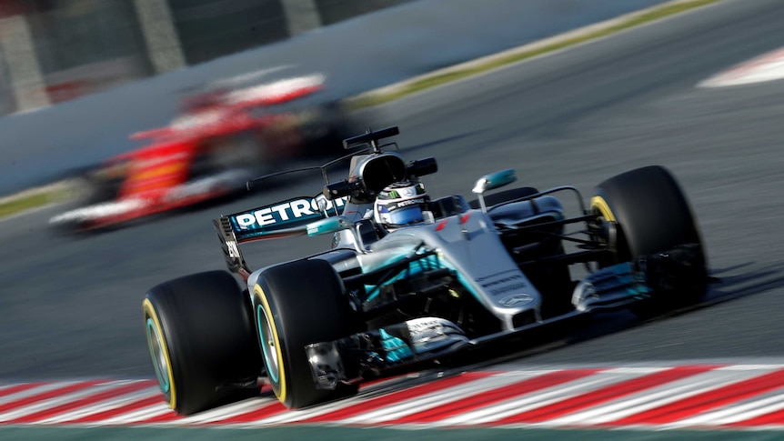 Mercedes' Valtteri Bottas is followed by Ferrari's Sebastian Vettel in F1 testing in Catalunya.