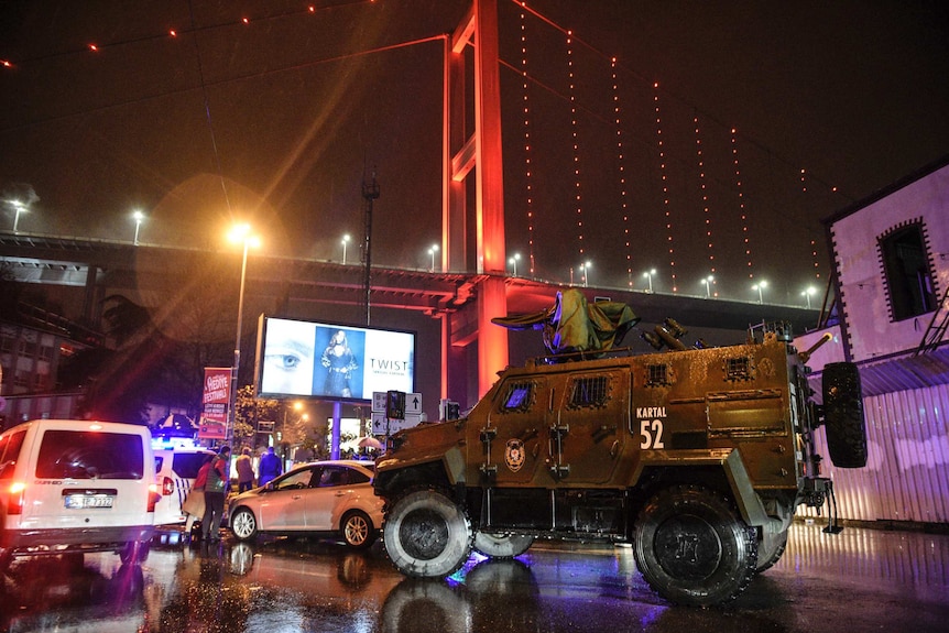 A police armoured vehicle blocks the road leading to the scene of a nightclub shooting.