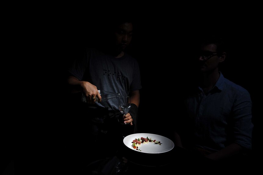 A plate is illuminated in the darkness