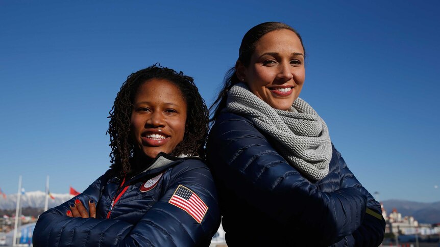 Crossing over ... US Bobsledders Lauryn Williams (L) and Lolo Jones