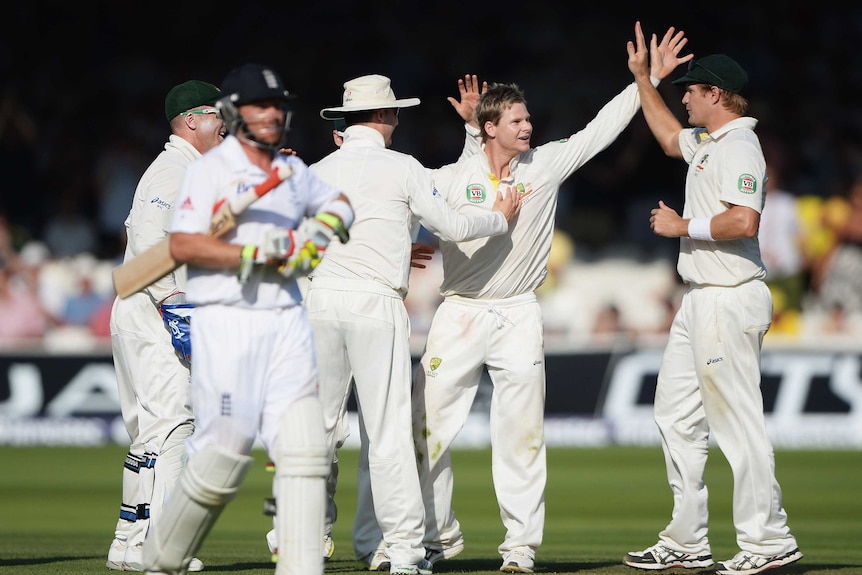 Man of the moment ... Steve Smith celebrates the wicket of Ian Bell with his team-mates