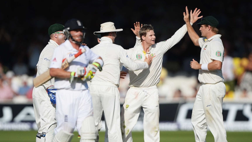 Man of the moment ... Steve Smith celebrates the wicket of Ian Bell with his team-mates