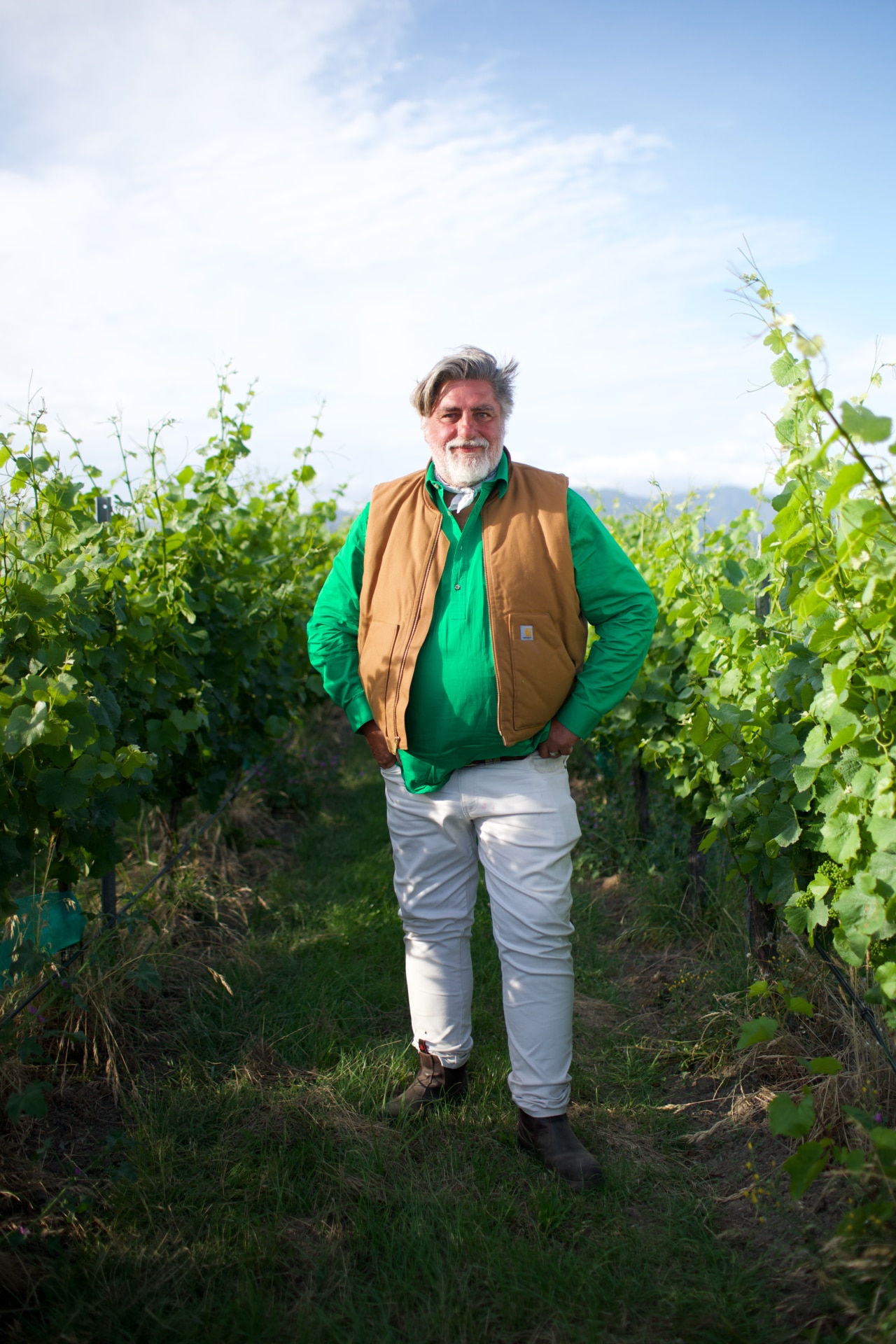 Matt Preston standing in a vineyard agaisnt a blue sky