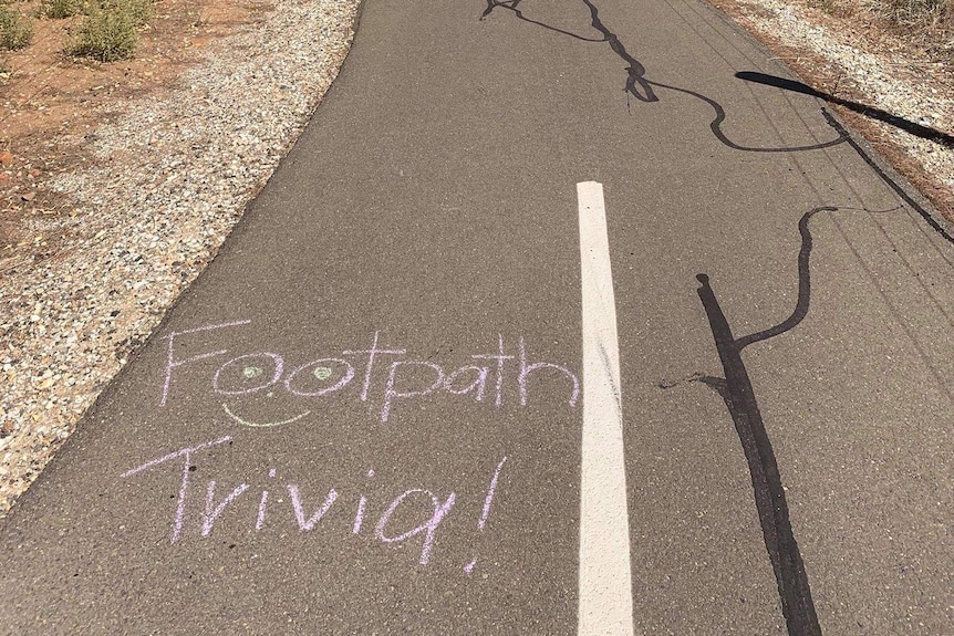 The words 'footpath trivia!' written on a bike path.