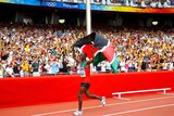 Samuel Wanjiru celebrates the marathon win