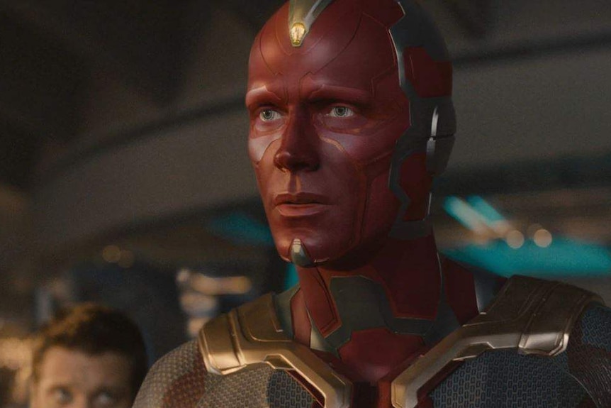 Vision, a red-coloured machine man, with the mind stone.