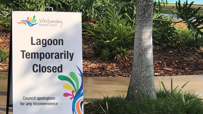 A 'Temporarily Closed' sign at a lagoon in Airlie Beach where a man and his five-year-old son drowned on October 28, 2018.