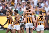 Sam Mitchell celebrates with David Hale