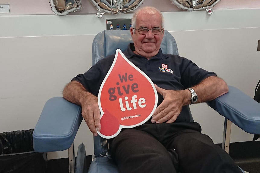 Man sitting in chair after giving blood.