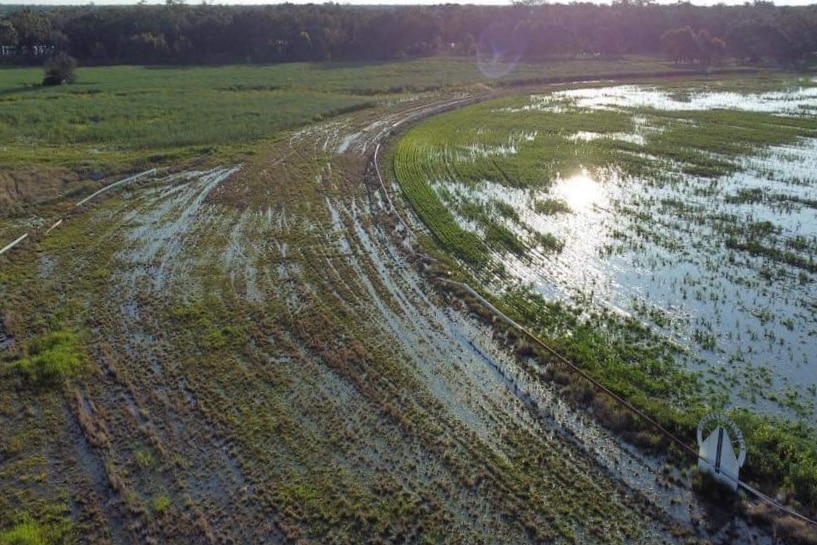 Aerial view of a waterlogged race track.