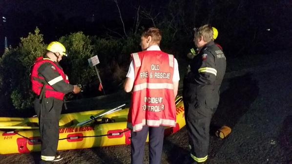 Rescue personnel beside a rubber boat