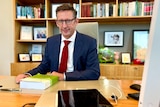 Minister in his work office