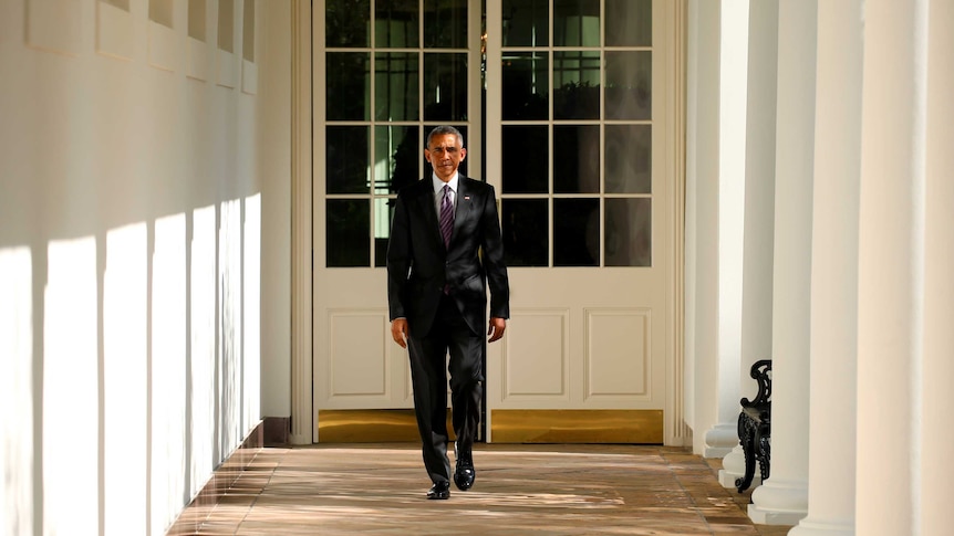 Barack Obama walks the Colonnade toward the Oval Office