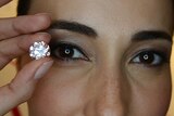 Model Lisa S holds a Martian Pink Diamond