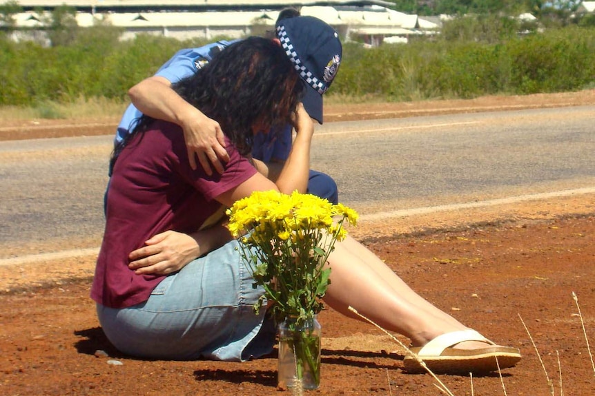 Ingrid Bishop being comforted by police