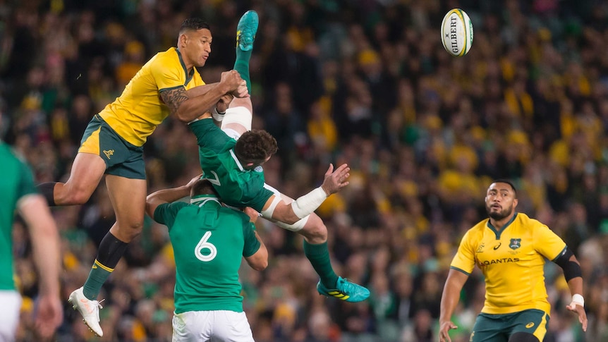 Israel Folau makes contact with Peter O'Mahony as they contest the ball in the third Test between Australia and Ireland.