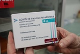 A close-up shot of a box holding the AstraZeneca vaccine.