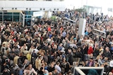 Thousands of people gather in Cairo's international airport.