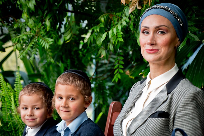Yehudit Korkus pictured with her two sons.