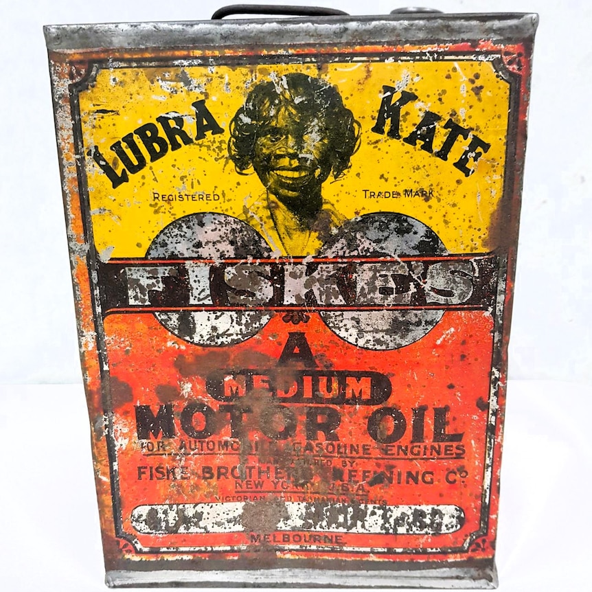 An old brightly coloured motor oil tin printed with Lubra Kate and face of an aboriginal girl