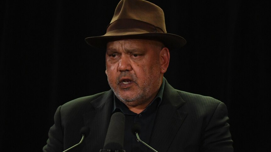 Noel Pearson stands at a microphone.