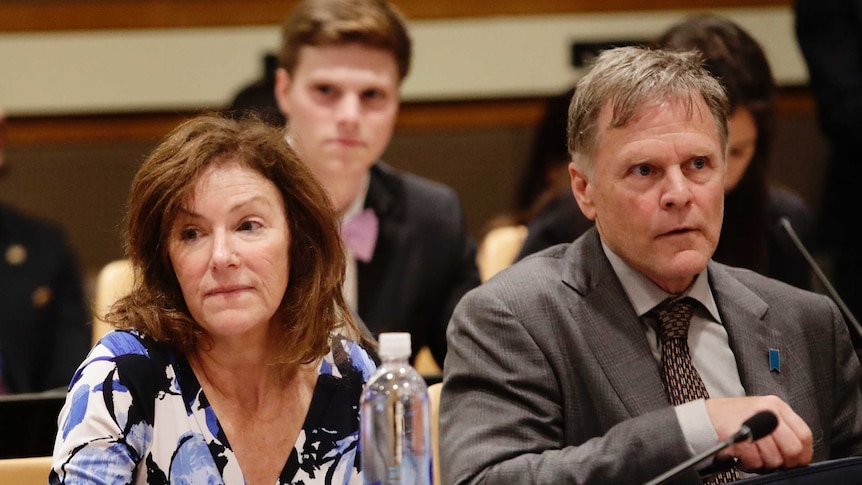 Fred Warmbier and Cindy Warmbier sit at a table as they speak at the United Nations