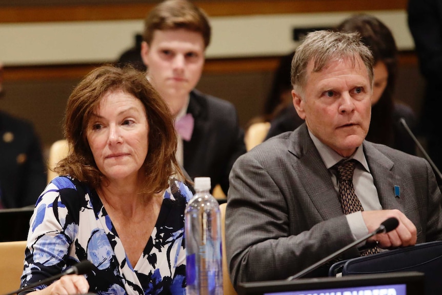 Fred Warmbier and Cindy Warmbier sit at a table as they speak at the United Nations