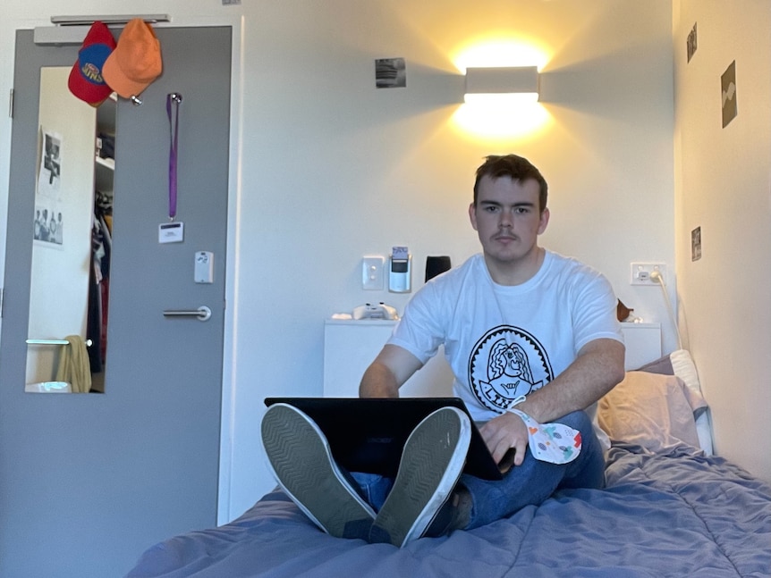 UQ student Grady Howard in his room at Student One