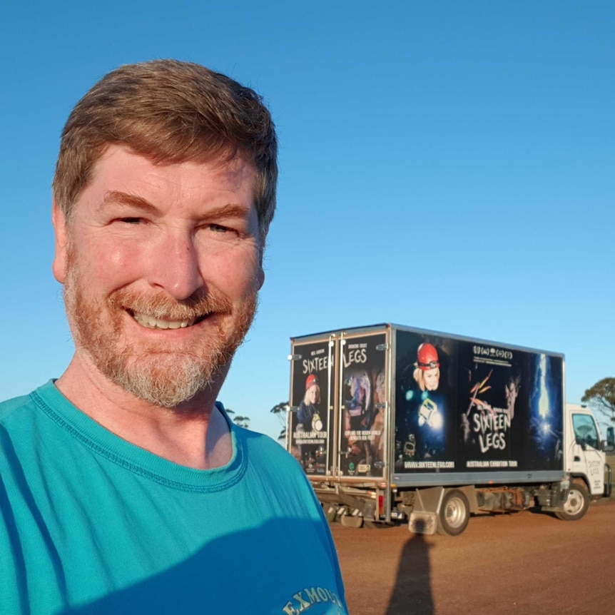 Niall Doran standing in the outback with the truck promoting his movie "16 Legs"