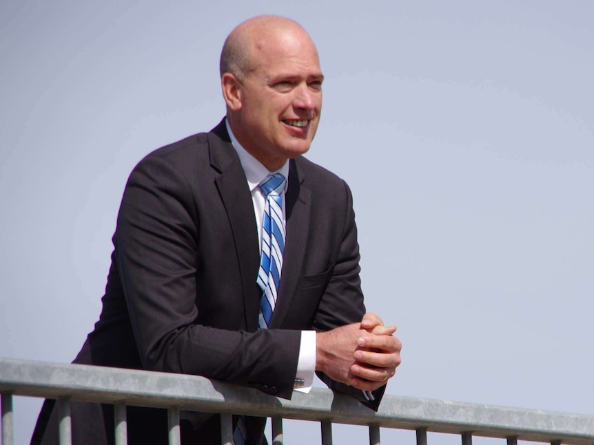 Transport Minister Dean Nalder rests on an overpass