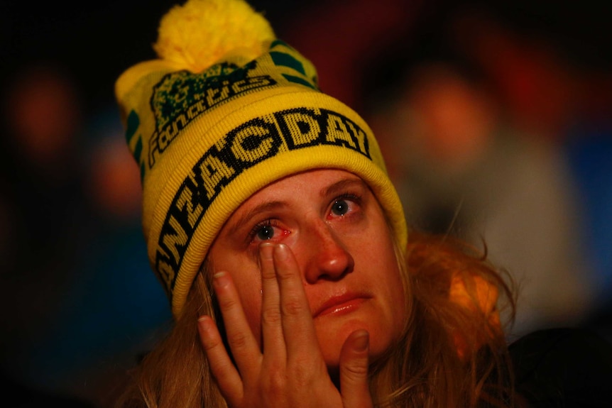 An Australian woman cries while watching the dawn service at Gallipoli.