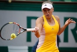 Caroline Wozniacki plays a forehand in her second-round loss to Julia Goerges