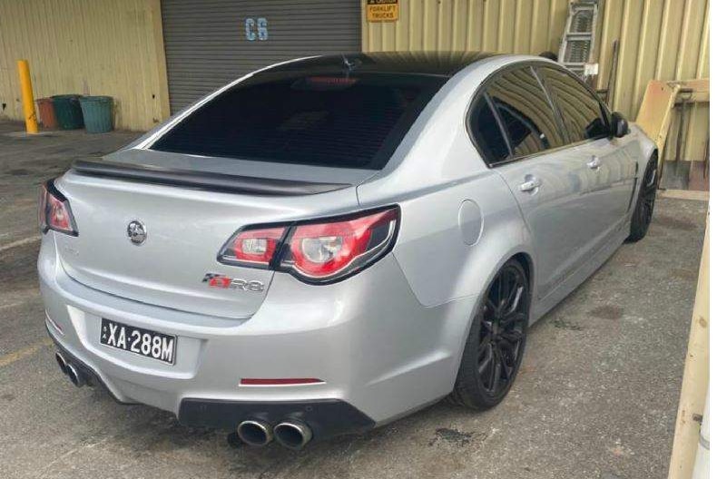 A composite of two photos of a silver sports model Holden sedan