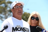 Jeff Fenech stands next to his wife Suzee while addressing the media