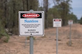 A Santos-branded Danger sign along a road