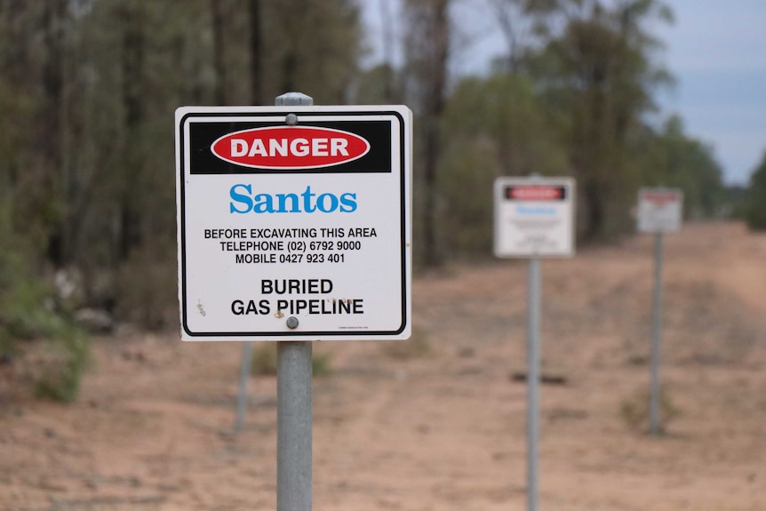 A Santos-branded Danger sign along a road