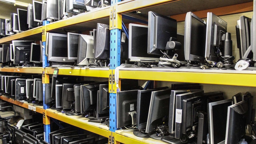 Rows of flat screen monitors sit on shelves